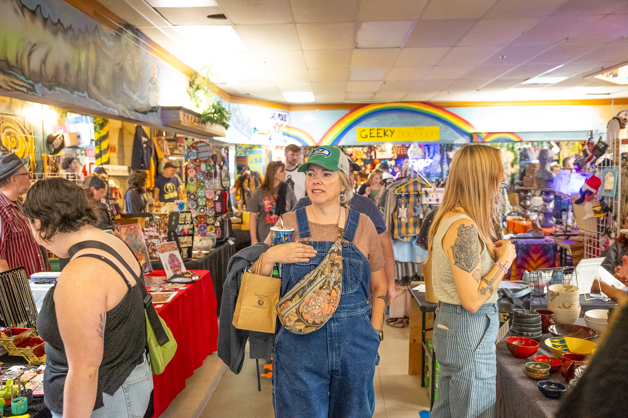 Shoppers browsing aisles of vendor tables at the swap meet